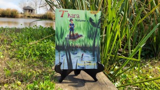 7" Kara Volume 2 in front of cattails