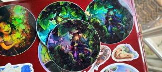 A cute little witch running through the berries- now as a holographic sticker!