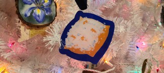 Beignet ornament on a white Christmas tree