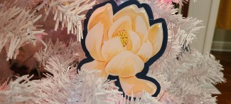 Magnolia ornament on a white Christmas tree